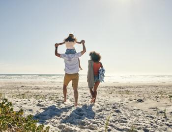 A family walks on a 30A beach