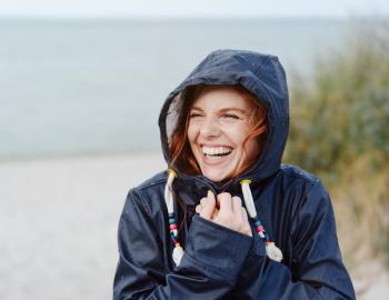 A woman smiles on a 30A rainy day