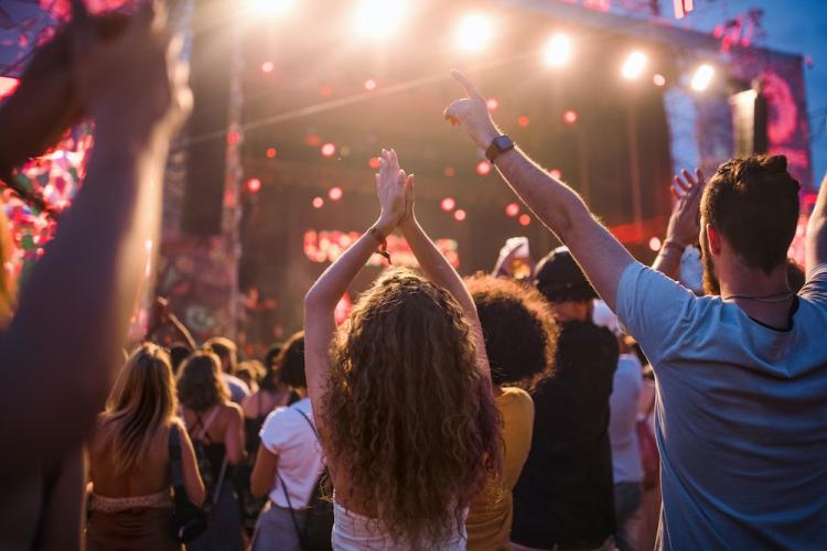 Friends dancing at a music festival.