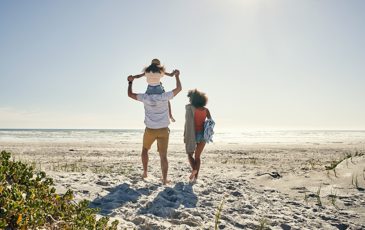 A family walks on a 30A beach