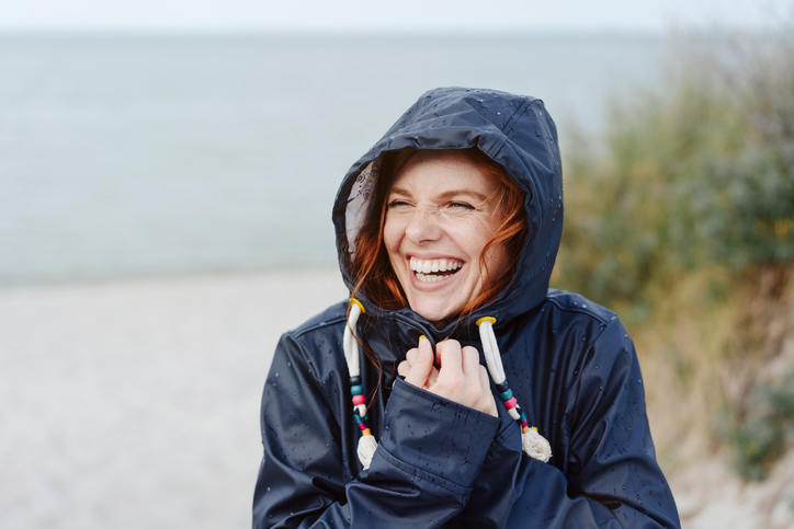 A woman smiles on a 30A rainy day
