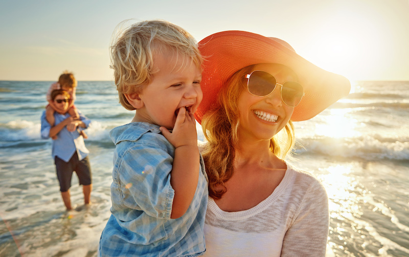 A mother and little boy on the beach