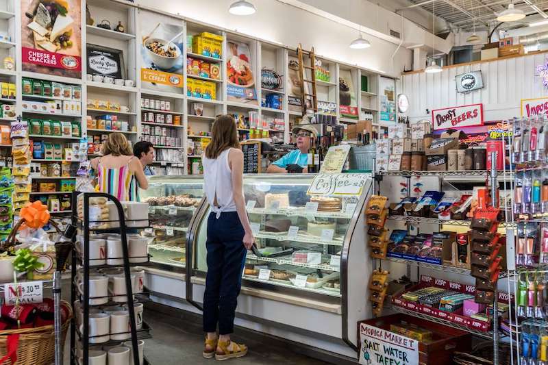 A woman shops in a 30A grocery store